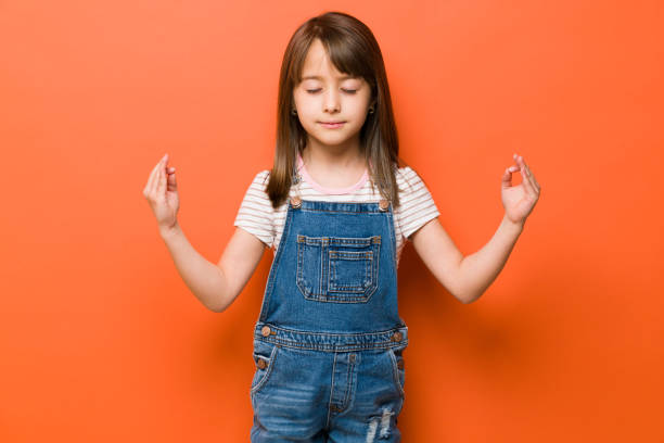 istock Pretty girl meditating in a studio 1386514439