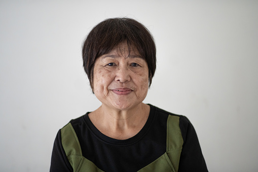Headshot of friendly Asian Chinese senior woman