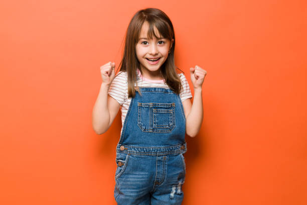 istock Excited little girl celebrating 1386514663