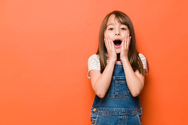 istock Surprised little girl in a studio 1386514684
