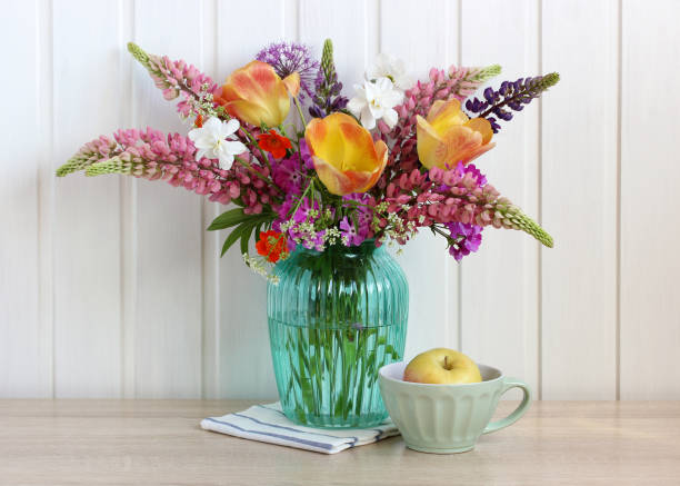 istock summer bouquet with lupines and tulips on the table. 1386516821