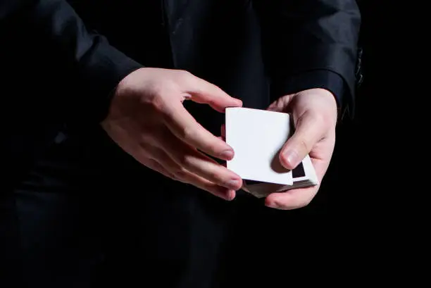 Men hands showing a playing-card trick