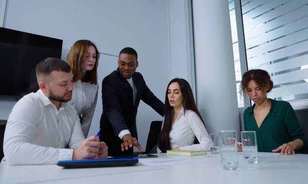 istock Diverse team brainstorming at business meeting in office 1386517225