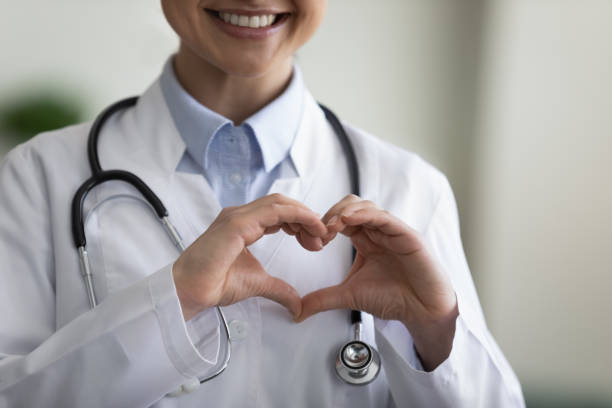 istock Close up happy young Indian doctor making heart gesture. 1386519191