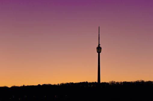 Scenic view of landmark Stuttgart TV Tower against pastel coloured clear sky, early morning, no clouds, no contrails, Dec 21, 2021