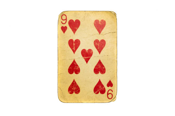 King, Queen and Jack playing cards in close up on white background