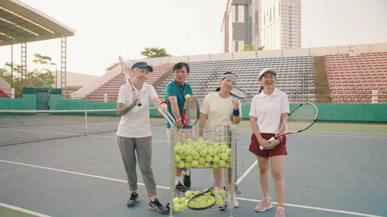 Portrait of seniors tennis game on tennis court