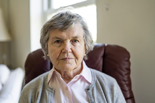 Headshot of an 80 year old female at home