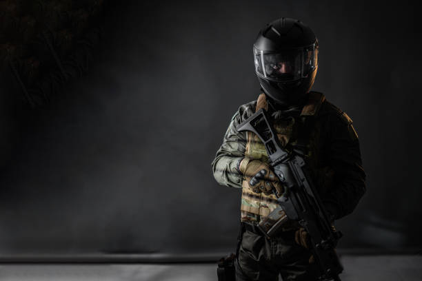 istock Male soldier with a rifle 1386523541