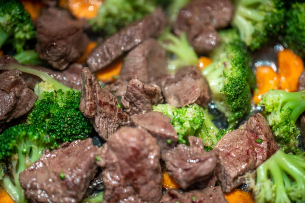 istock Meat with vegetables is fried in a pan 1386524300