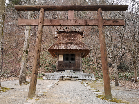 1 april 2019 - Shirakawa-go, Japan: Hatogayahachiman Shrine wooden torii at Shirakawa-go