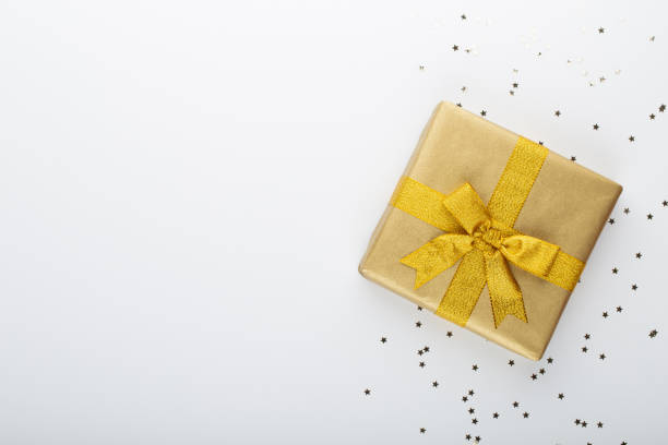 istock Gift or present box and stars confetti on color table top view. Flat lay composition for birthday, mother day or wedding. 1386527306