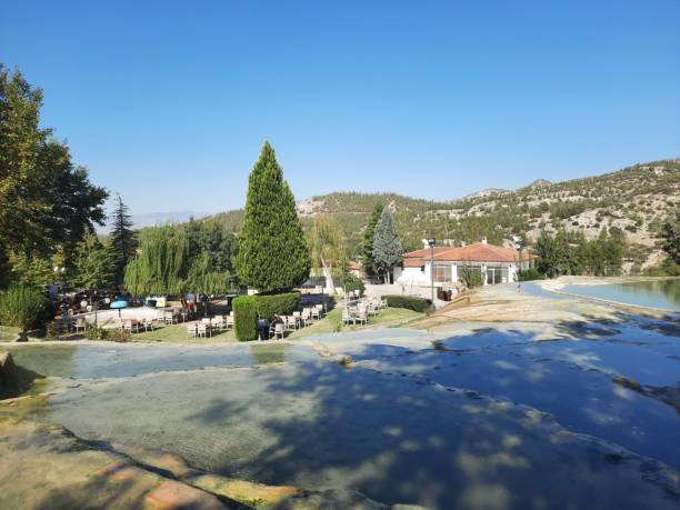 The red springs of Karahayit are a separate spring water with a unique combination of minerals that has caused this water to flow out red, leaving behind the rust-colored travertine, Denizli The red springs of Karahayit are a separate spring water with a unique combination of minerals that has caused this water to flow out red, leaving behind the rust-colored travertine, Denizli. n11 stock pictures, royalty-free photos & images