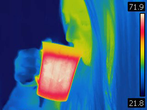 istock Thermal image of woman drinking hot tea 1386529039