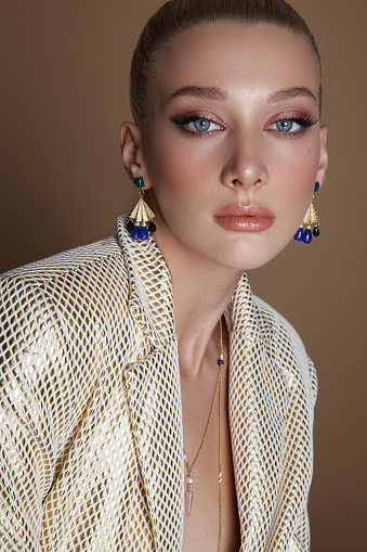 Portrait of attractive blonde woman with jewelry and stylish outfits