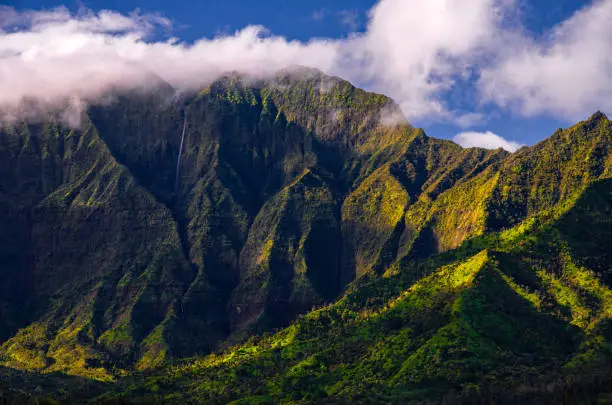 Clouds over Hanalei bay cliffs at sunrise