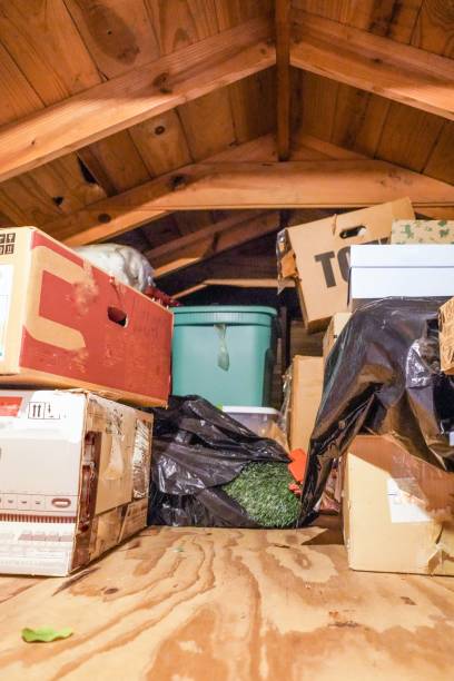 Attic, Loft, Crawl-Space A disorganized attic. loft, or crawl-space above the residential garage. christmas decoration storage stock pictures, royalty-free photos & images