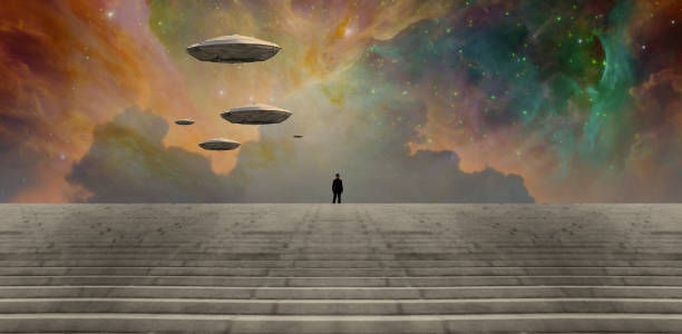 istock Man in black suit and flying saucers 1386533705