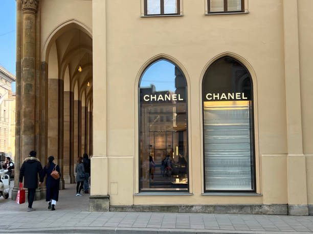 Chanel Fashion Store Munich, Bavaria Germany - February 22, 2022: Chanel high-end German fashion store shop front logo. karl lagerfeld stock pictures, royalty-free photos & images