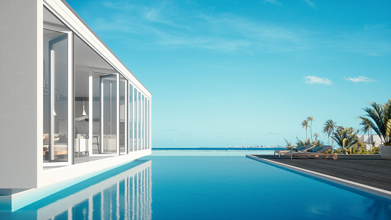 Luxury modern overwater holiday villa with infinity pool and beautiful sea view.