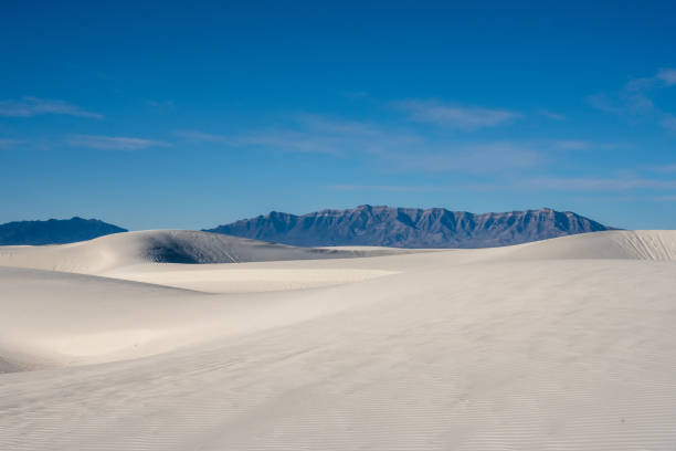 istock San Andres Mountains Peek Out From Behind Sweeping White Sand Dunes 1386544486