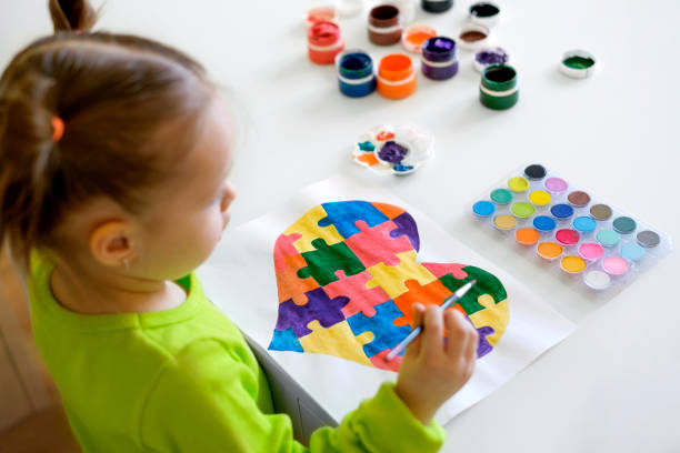 istock Baby draws a multicolored heart with gouache. 1386551984