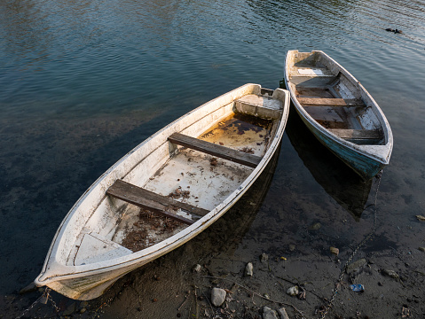 Old boat om adda river in Lombardy