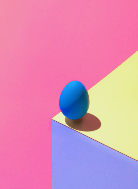 istock Modern optical illusion made of Easter egg on colorful background. 3D render blue egg on paper cube. Abstract Easter composition. 1386559958