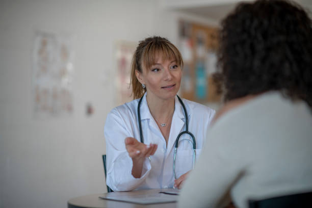 istock Female Doctor with a Patient 1386568519