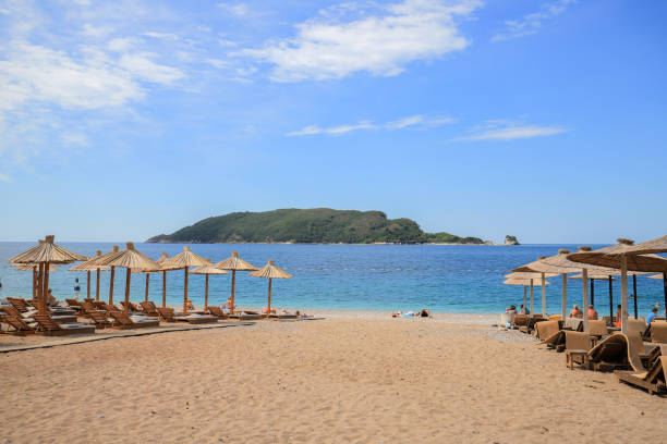 istock Beautiful beach with sunshades in Montenegro 1386576512