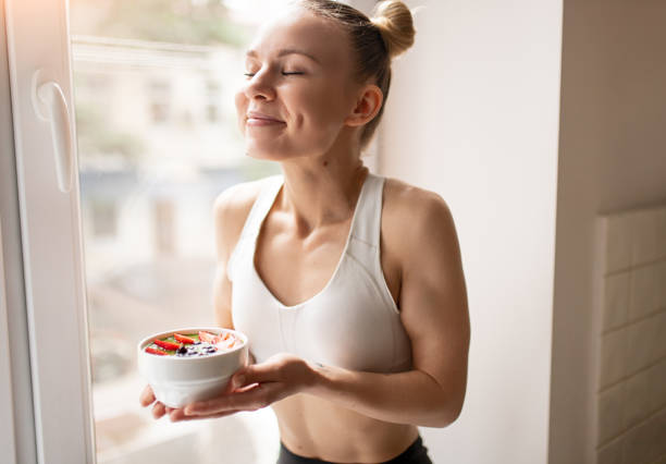 istock Female athlete with fruit porridge 1386577958