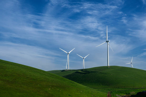 istock Wind Turbines On Green Grassy Hill 1386578698