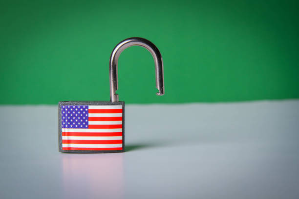 istock US sanctions. Closed padlock with USA flag. Supply ban. 1386587769
