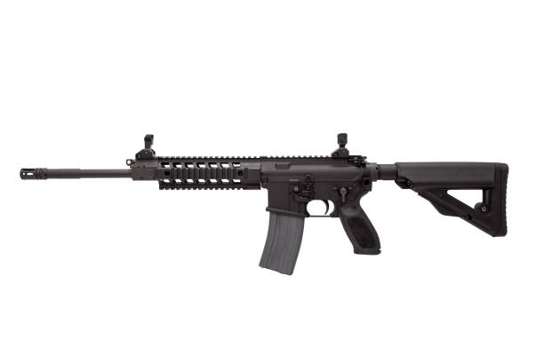 istock Modern automatic rifle isolated on black background. Weapons for police, special forces and the army. A carbine with optical, mechanical sights and a silencer on a dark background. 1386590364