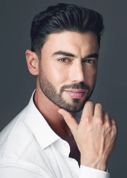 istock Studio shot of a handsome young man posing against a grey studio background 1386596103