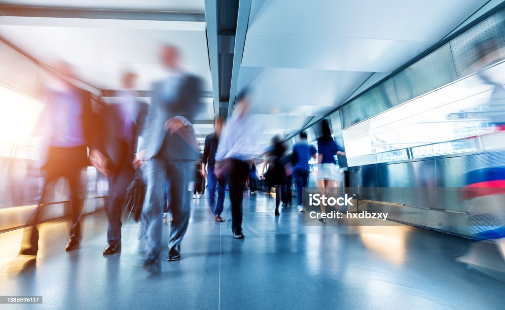 Business people rushing in the lobby Business people rushing in the lobby. People Stock Photo