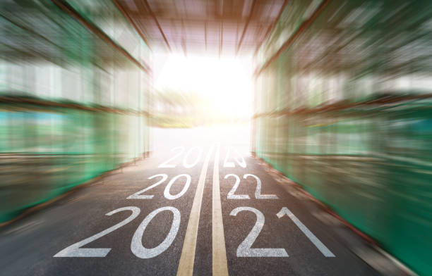 istock Motion blurred driving through the tunnel with number 2021 to 2023 1386596171