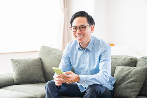 istock young man who uses smart phone 1386598844