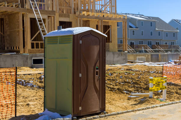 Portable restroom on house under construction in a new house