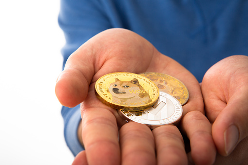 Teenager hand holding crypto coin on cut out white background.
A cryptocurrency, crypto-currency, or crypto is a digital currency designed to work as a medium of exchange through a computer network that is not reliant on any central authority, such as a government or bank, to uphold or maintain it.