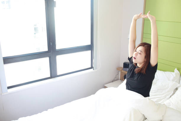 istock asian woman wake up with good mood 1386603042