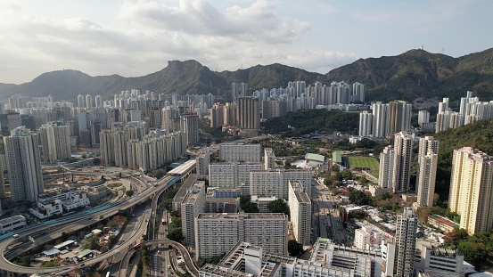 Eastern Kowloon drone view , sunset view with lion rock mountain range and dense house estate