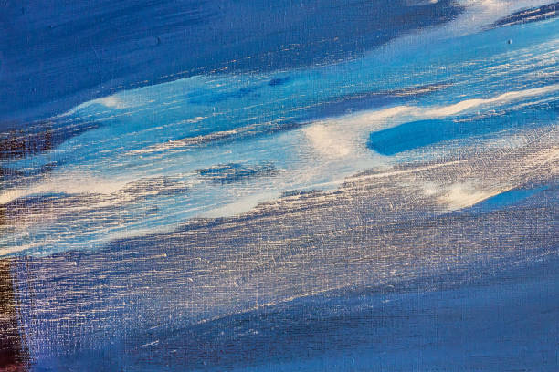 istock expressive brush strokes of white colors on blue painted canvas 1386607413