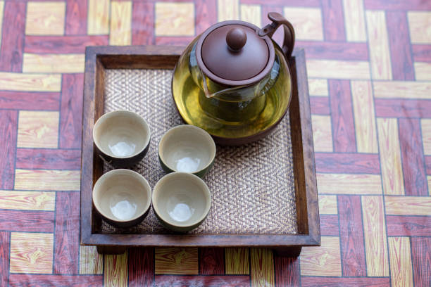 istock Set of tea cups on a wooden tray 1386611270