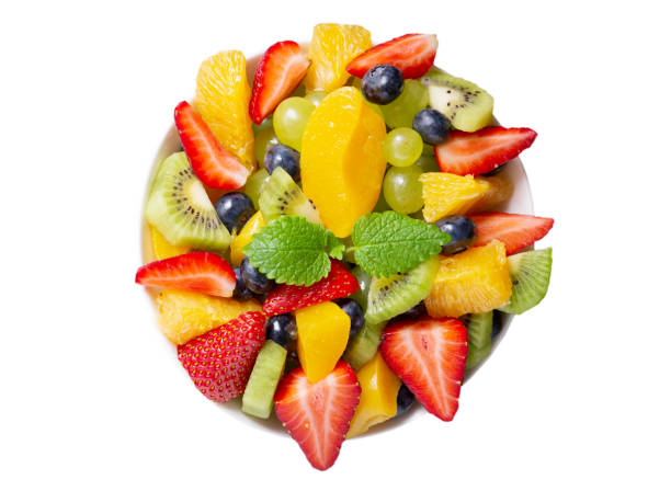 istock bowl of fruit salad on white background, top view 1386612834
