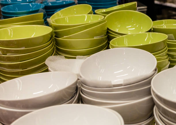 istock Shelves are lined with multi-colored plates and china bowls. Decorative cutlery. 1386614701