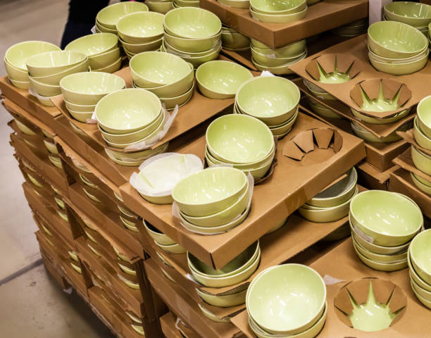 istock Shelves are lined with multi-colored plates and china bowls. Decorative cutlery. 1386614743