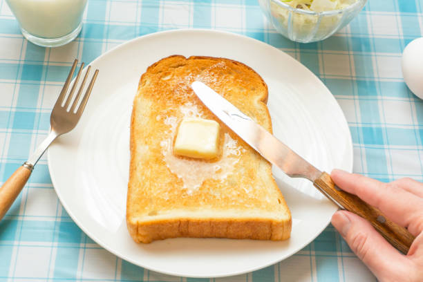 istock Breakfast bread. Toast and melting butter. 1386617060