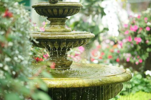 water flowing fountain decorating in garden