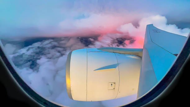 beautiful sunset  light effect in cloudy sky from the mid air from airplane window. - cloud mid air cloudscape aerial view imagens e fotografias de stock
